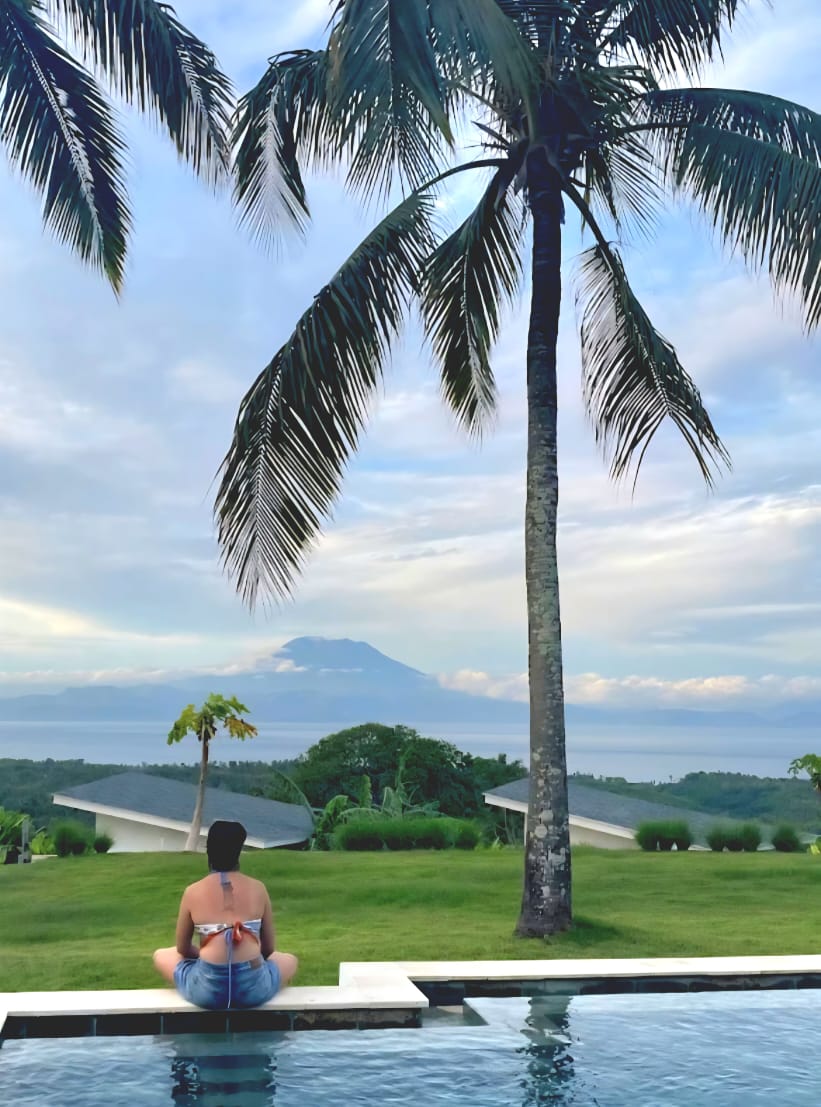 Private infinity pool at sunrise with floating breakfast tray